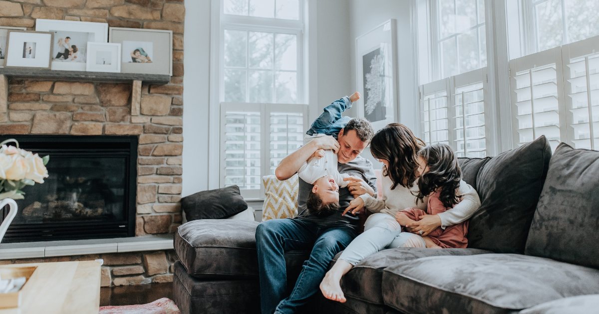 Family warm together in a Bendigo living room heated through winter
